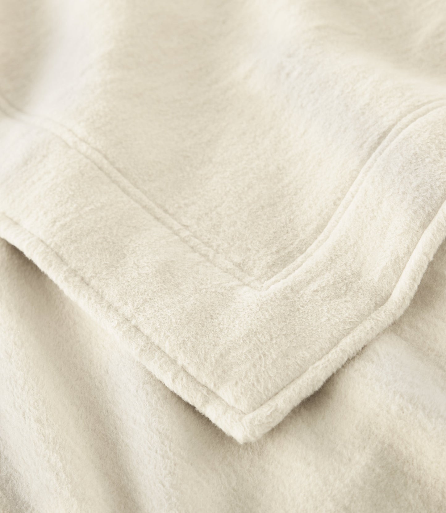 Close up of framing detail of All Seasons Framed Cotton Blanket, Natural