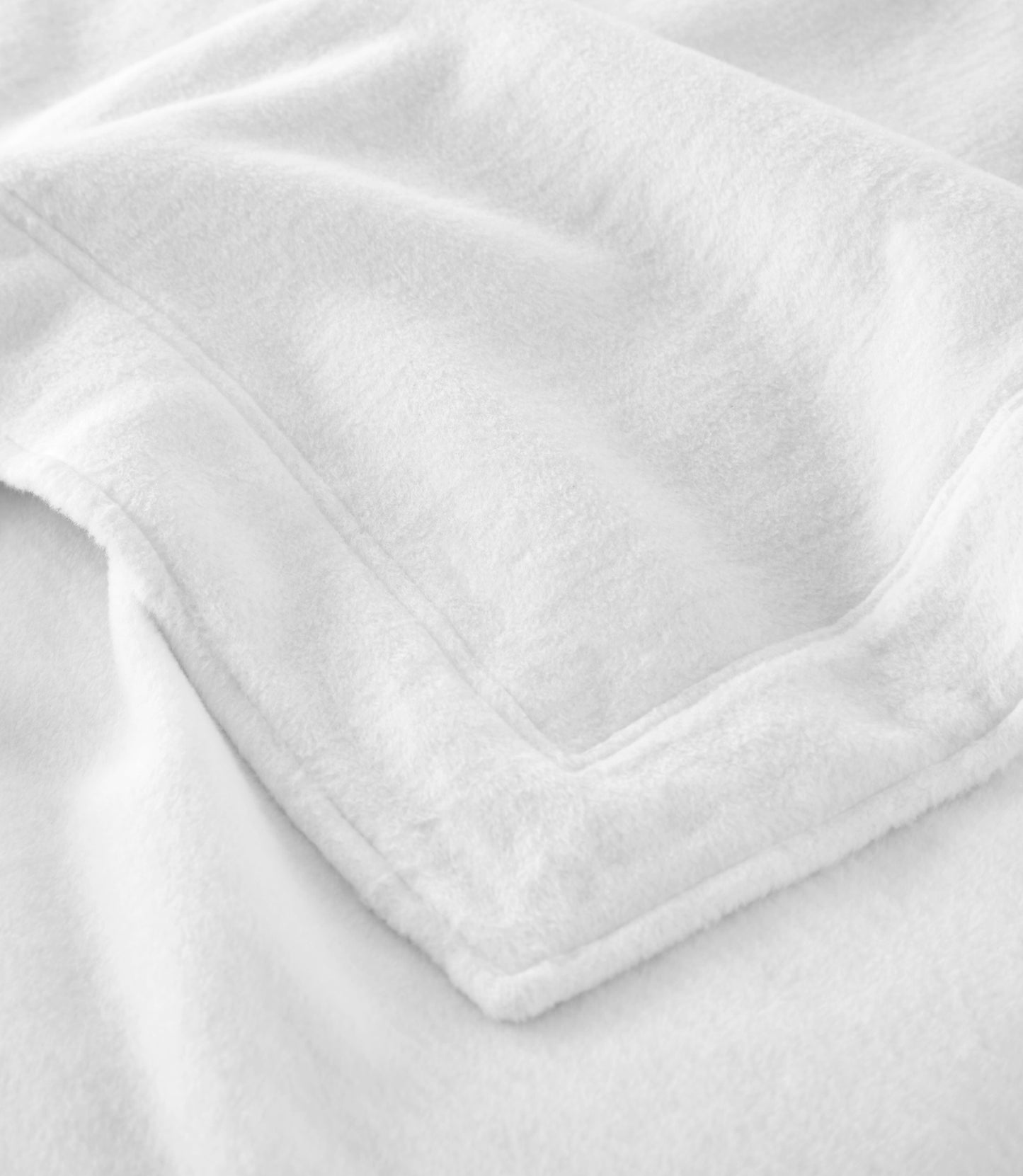 Close up of framing detail of All Seasons Framed Cotton Blanket, White
