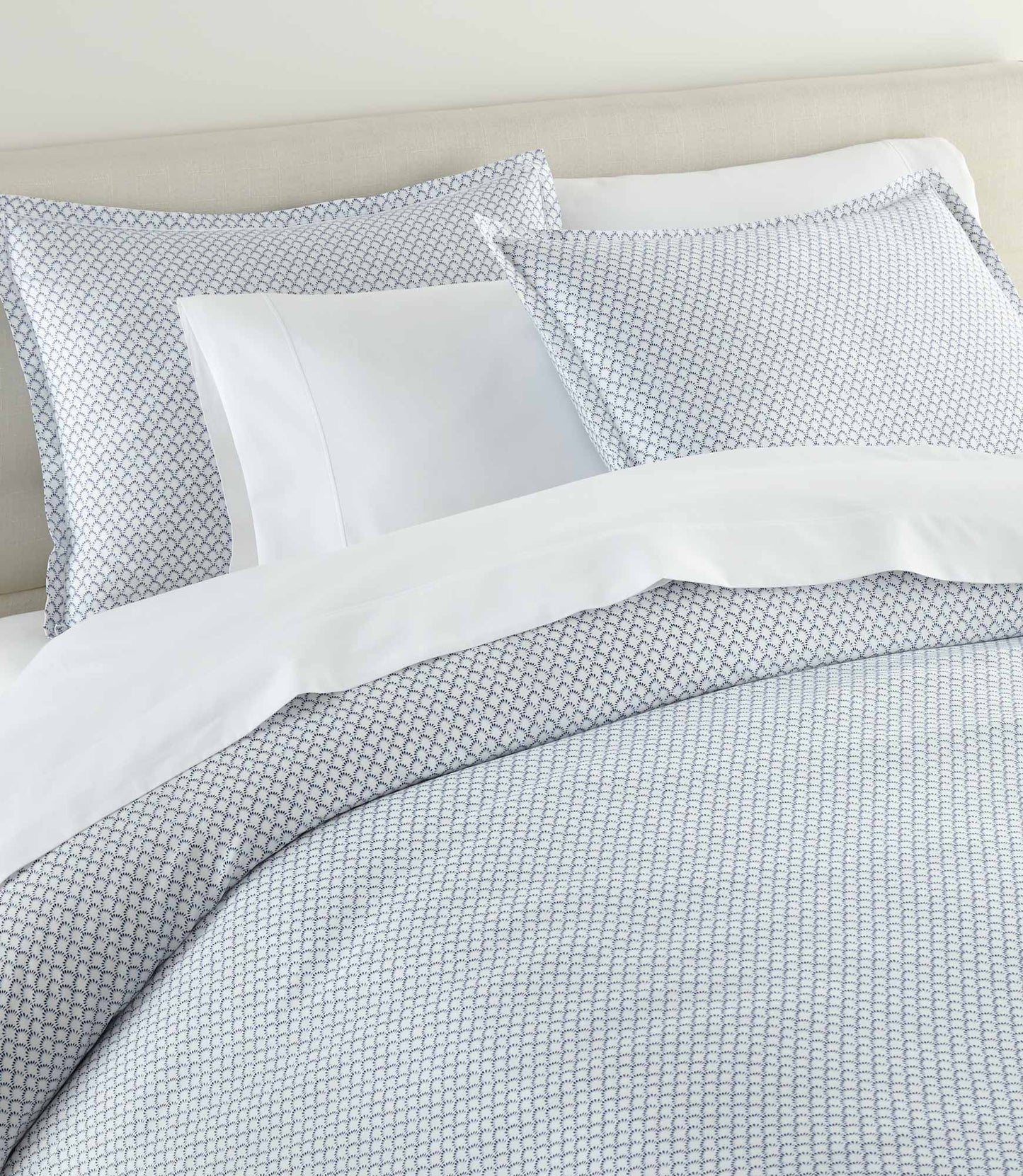 Demi Classic Printed Duvet and Shams set on bed with white sheets, Demi Navy