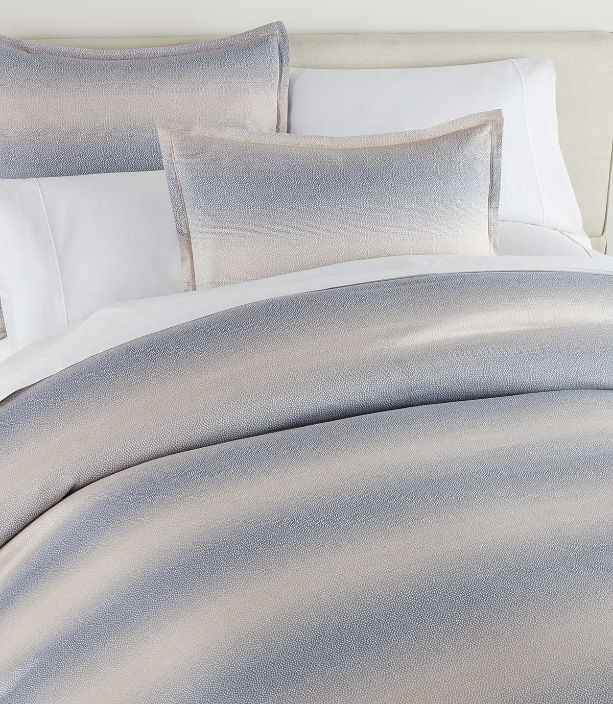 Elena Jacquard Shams on bed with matching duvet cover, Blue