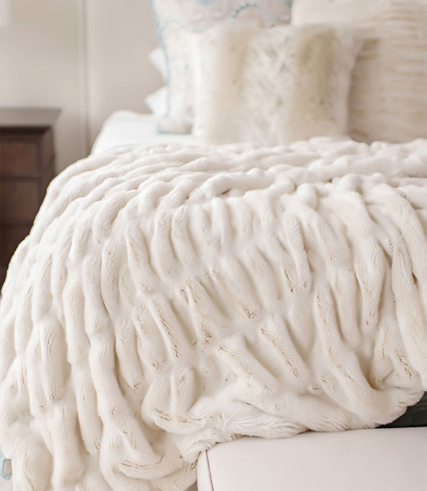 Mila Faux Fur Throw Blanket on bed, Pearl