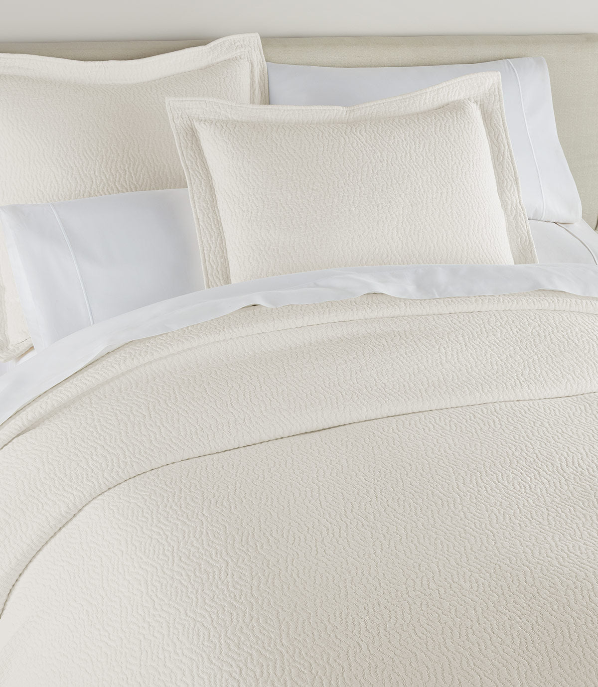 Mia Matelasse Coverlet on bed, Pearl