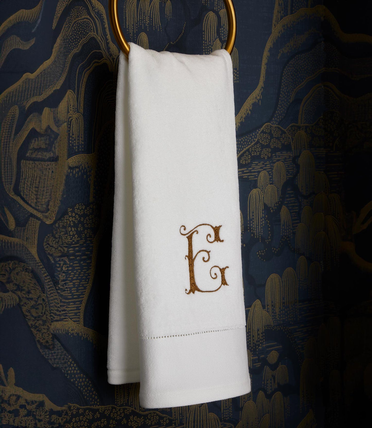 Special Occasion hand towel hanging on towel loop, White