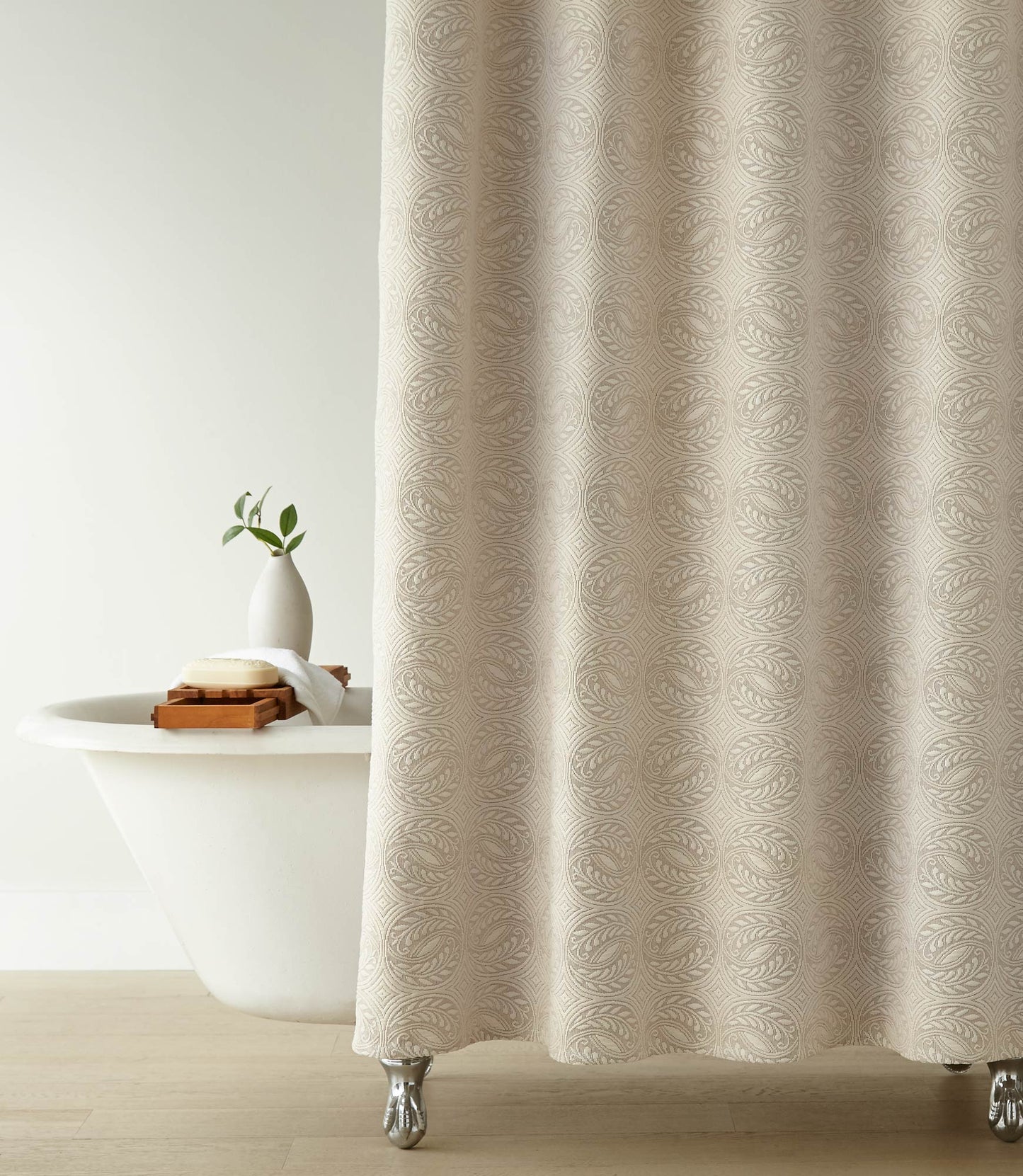 Vienna Matelassé Shower Curtain in a bathroom setting with a white bathtub and decorative items, Linen