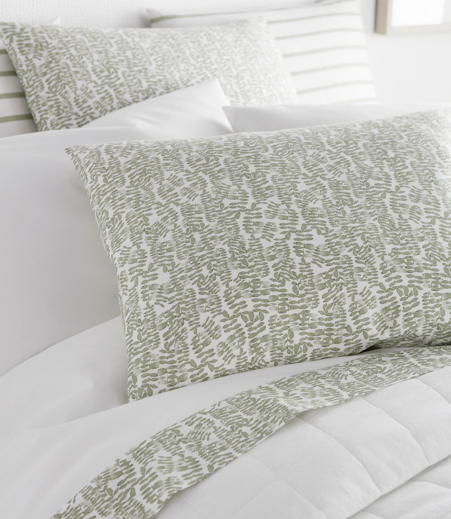 Fern Percale Sleeping Shams Olive on Bed