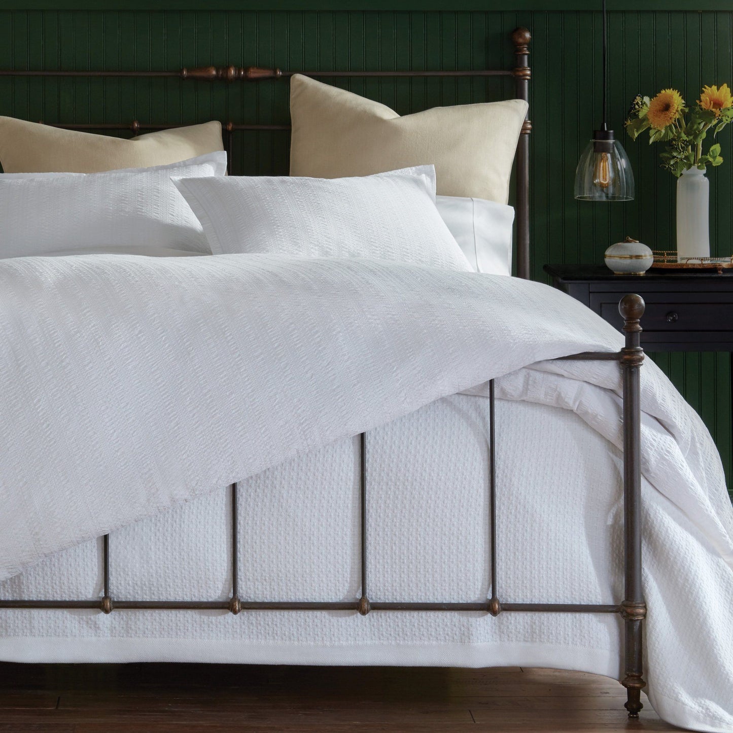 Harper white duvet and shams on brass framed bed