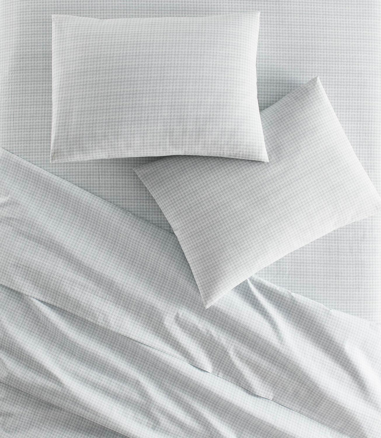 Houndstooth Percale Sheets on bed Light Blue