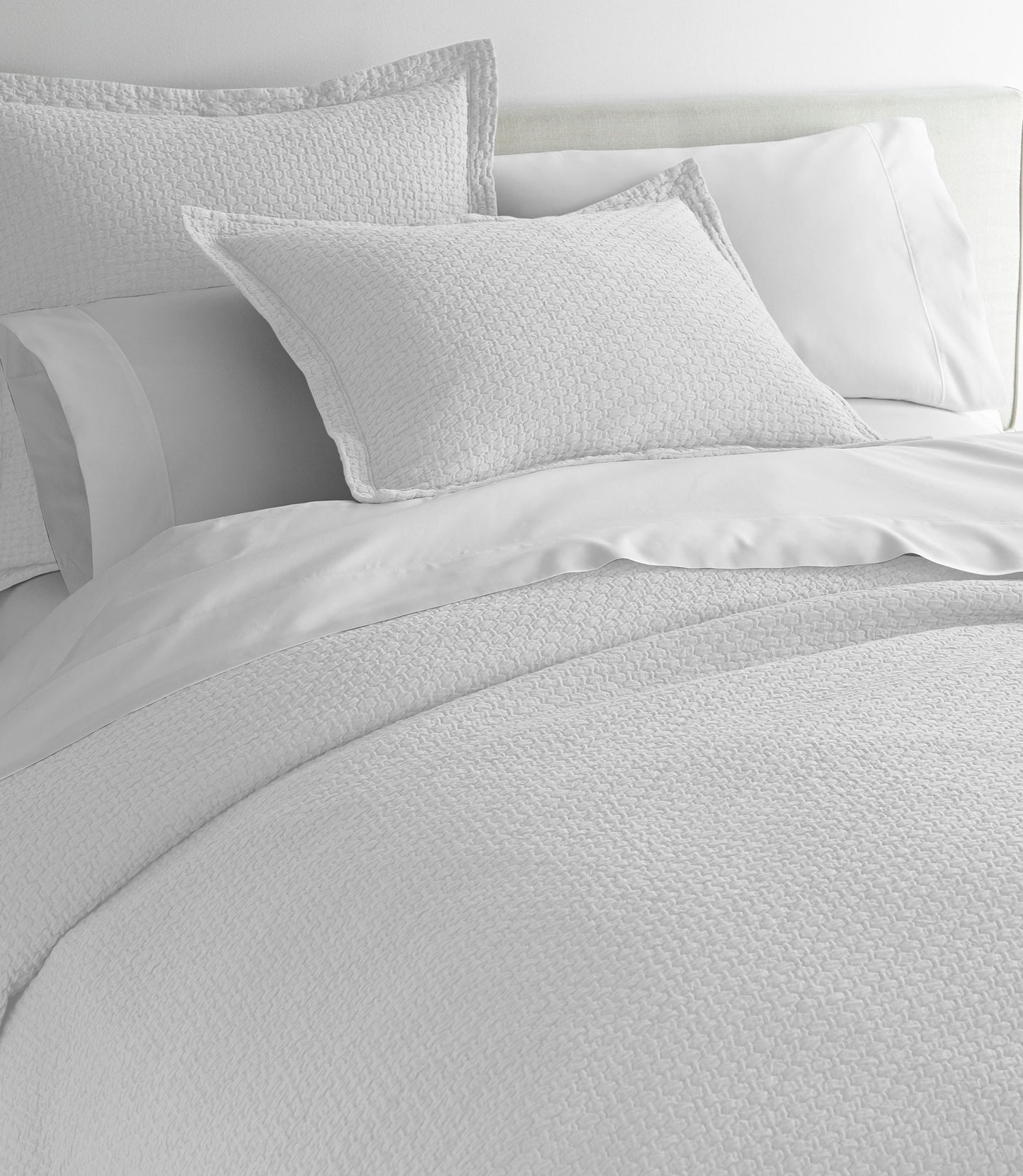 White Juliet coverlet and sham on bed, Juliet Matelasse Sham