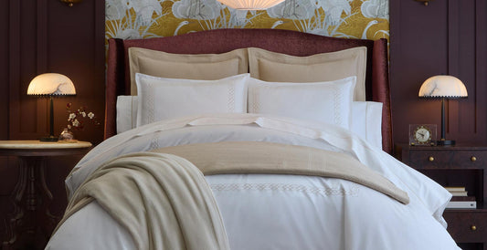 Layered bed with a maroon headboard