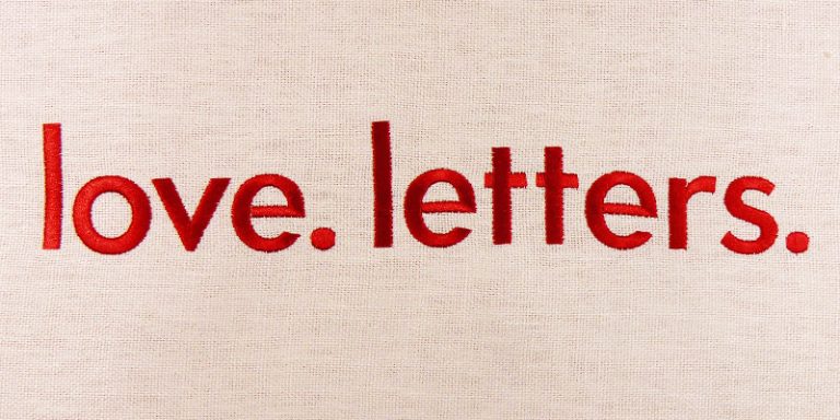 Red embroidery reading love. letters.