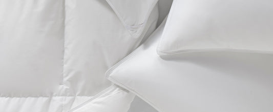 Stop feathers poking through down pillows with a pillow protector. | Peacock Alley