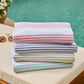 Aegean Stripe Beach Towel Multi Stack lifestyle poolside, Coral Navy Lime Aqua