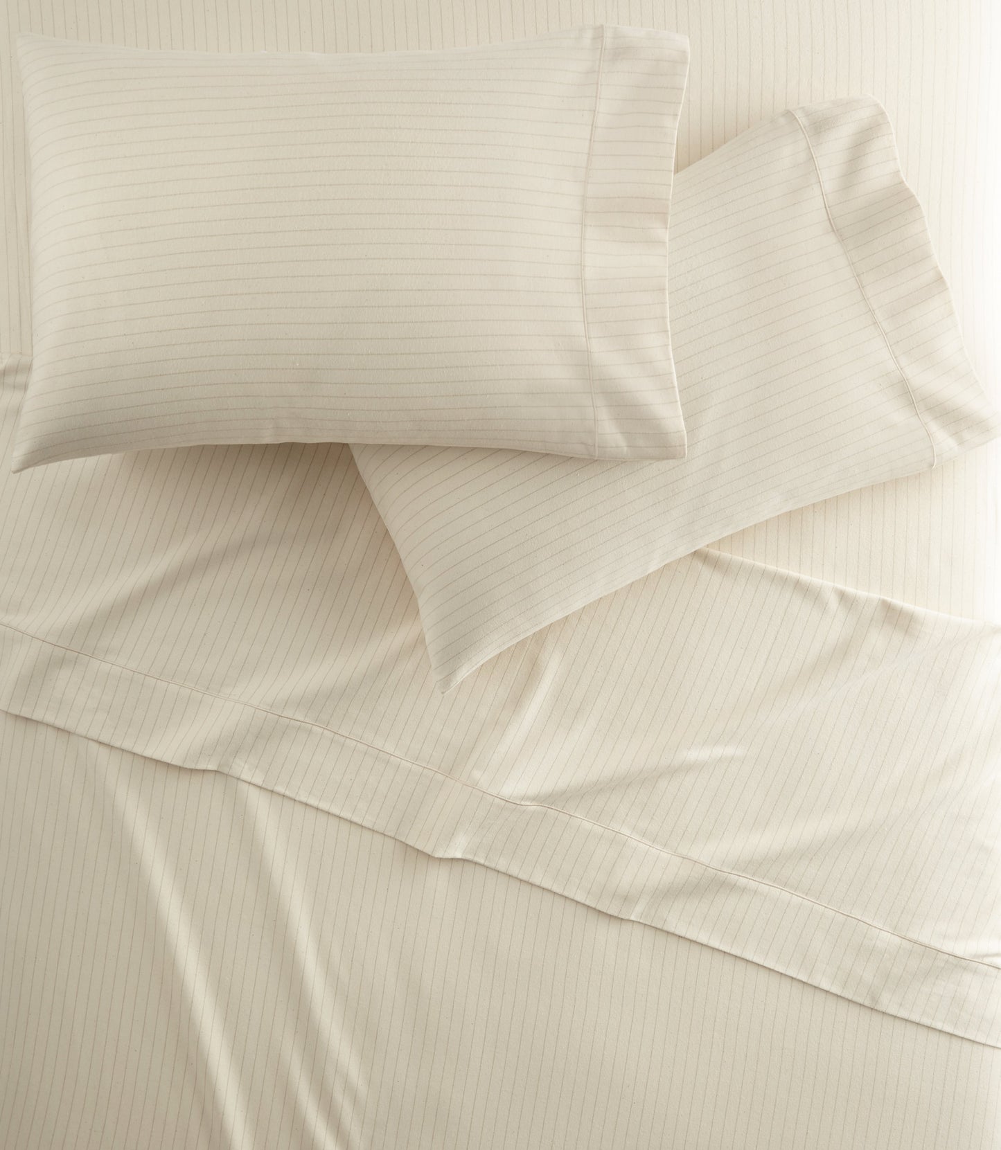 All Seasons Brushed Sheet Set on a bed, Pearl