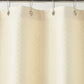 Detail of Alyssa Matelassé Shower Curtain with silver rings on a rod against a white background, Natural