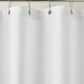 Detail of Alyssa Matelassé Shower Curtain with silver rings on a rod against a white background, White