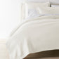 Angie Stonewashed Matelasse Coverlet Pearl on bed