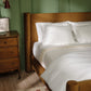 Clara duvet and sham set on velvet bed, White