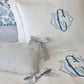Caitlin Oblong Pillow displayed on a blue bed, Stripe Wedgewood