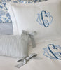 Caitlin Oblong Pillow displayed on a blue bed, Stripe Wedgewood