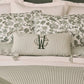Caitlin Oblong Pillow monogrammed on a green bed, Stripe Moss