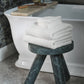 Catalina bath towels folded on bathroom stool, White