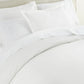 clara duvet and shams set on bed, White