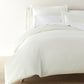 Clara duvet set on bed, Ivory