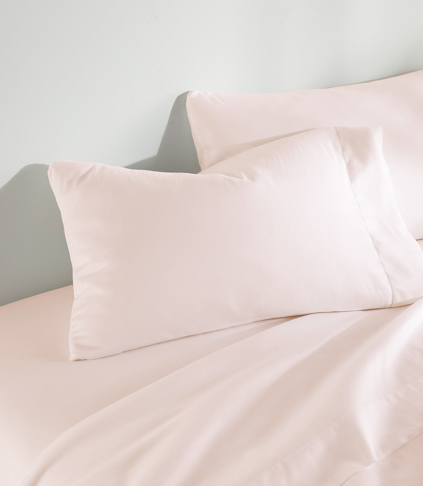 Clara Sateen Sheet Set on bed, Blush