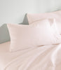 Clara Sateen Sheet Set on bed, Blush