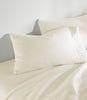 Clara Sateen Sheet Set on bed, Ivory