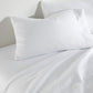 Clara Sateen Sheet Set on bed, White