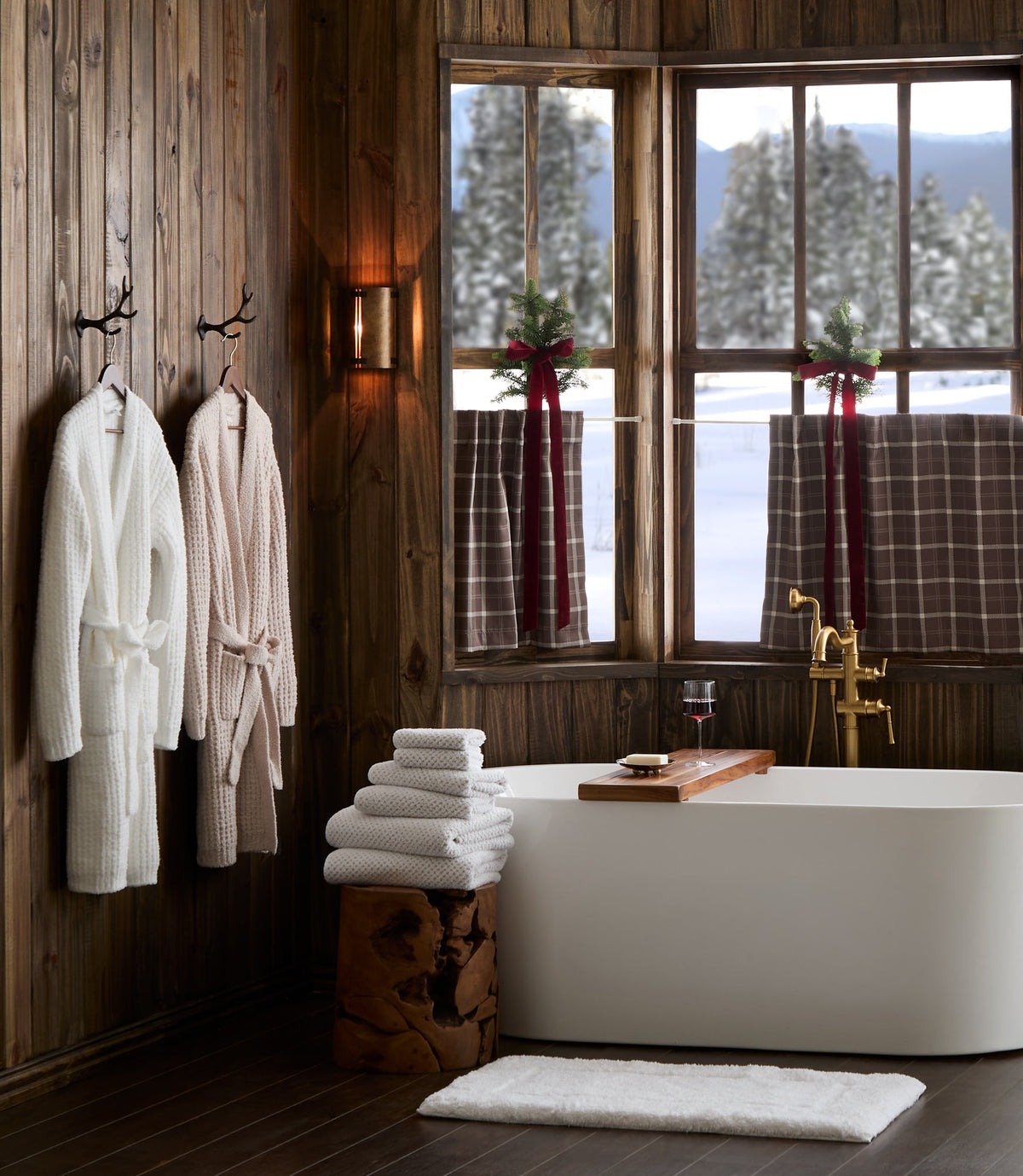 Cozy Waffle Robe hanging on cabin bathroom styled with Catalina Bath Towel and Tiffany Cloud Bath Rug