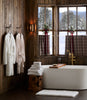 Cozy Waffle Robe hanging on cabin bathroom styled with Catalina Bath Towel and Tiffany Cloud Bath Rug