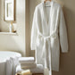 Cozy Waffle Robe hanging in bathroom, White