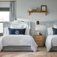 matching beds with blue and white printed bedding, Demi