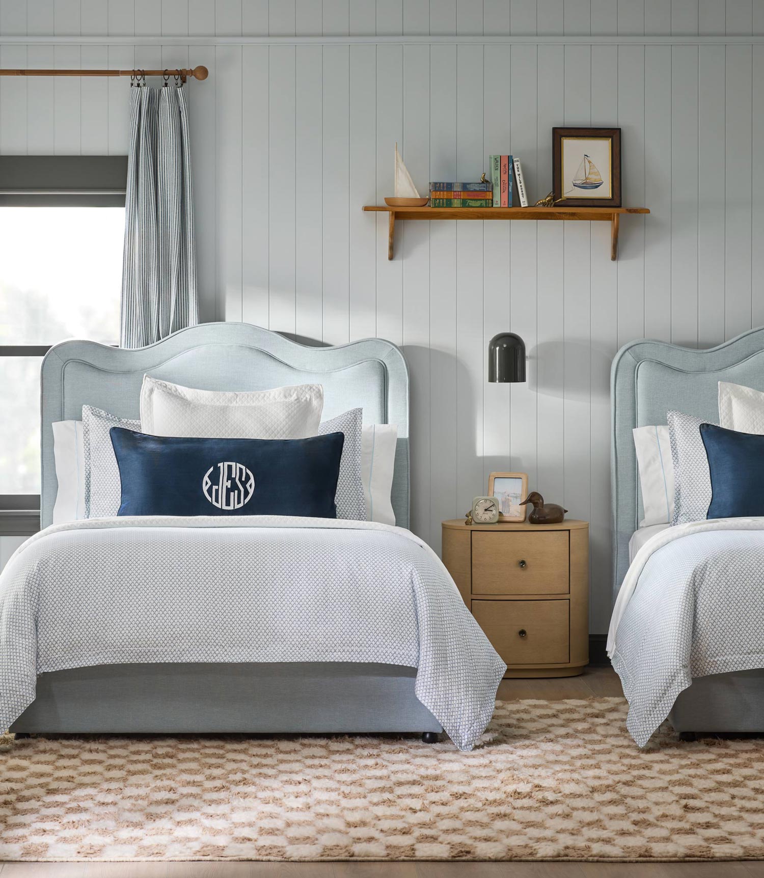 matching beds with blue and white printed bedding, Demi
