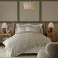 Ella Linen Duvet Set displayed in a beige paneled bedroom, Natural