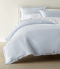 European Washed Linen Sheet Set on a bed with a cream colored head board, Sky
