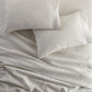 European Washed Linen Flat Sheet and pillows on bed, Natural