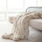 Mila Faux Fur Throw draped on couch, Ivory