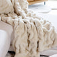 Faux fur blanket laying on couch, Ivory