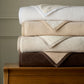 Favorite Reversible Cotton Blanket Stack on a dresser White Linen Flint Chocolate