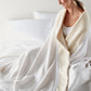 Favorite Cotton Blanket wrapped around woman on bed White