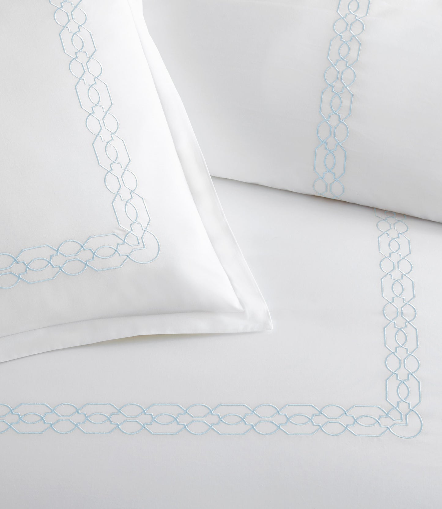 Close up of border detailing on Filigree Classic Embroidered Duvet Set, Sky
