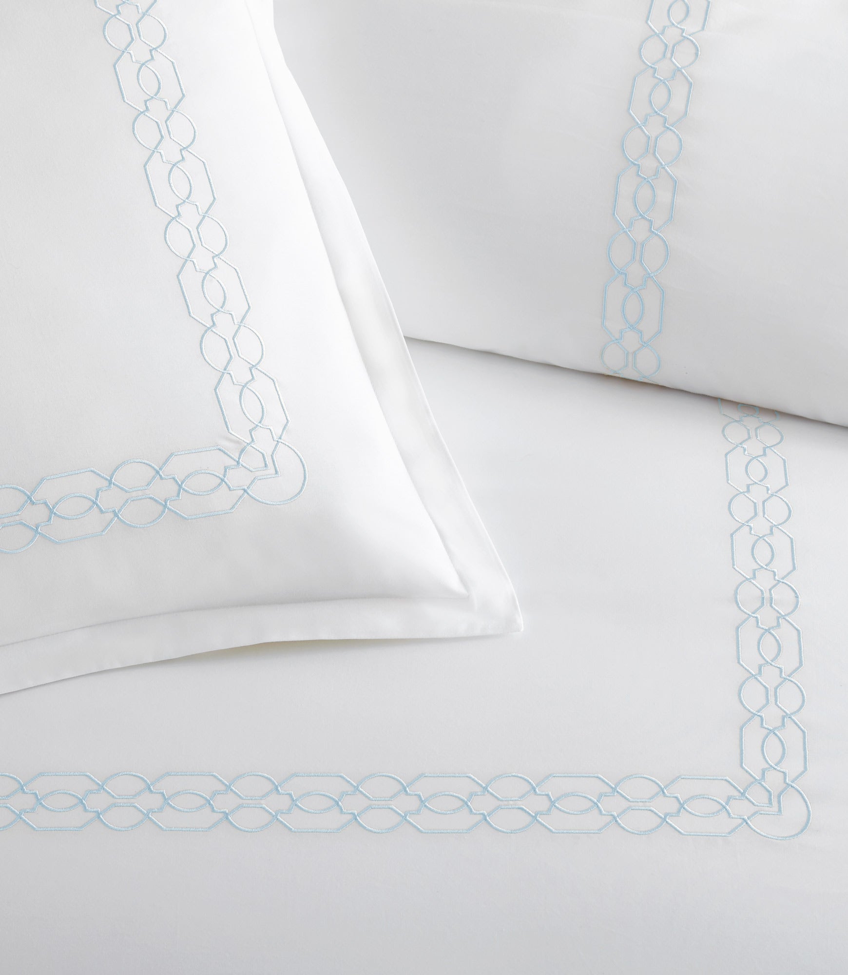 Close up of border detailing on Filigree Classic Embroidered Duvet Set, Sky