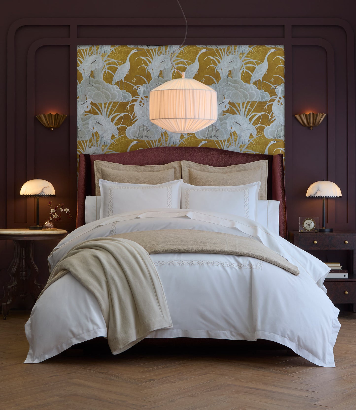 Decorative bedroom with Filigree Classic Duvet Set on the bed, a maroon headboard, and floral wall art.