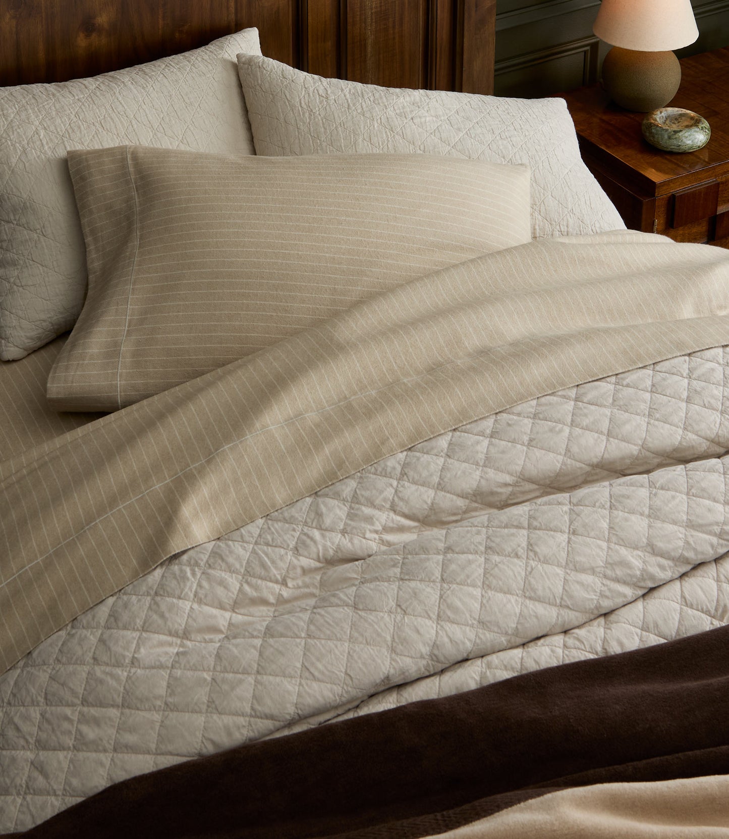 Heritage Linen Coverlet in Natural displayed on a bed