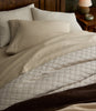 Heritage Linen Coverlet in Natural displayed on a bed