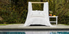 All white canopy bed outside by the pool