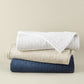 Heritage Stonewashed Coverlets stacked in White Natural Navy